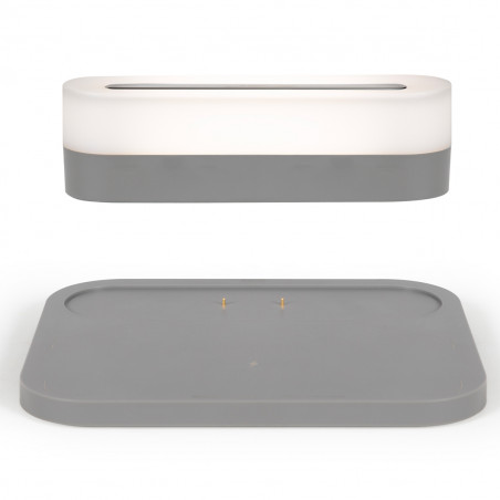 Station de charge illuminée avec veilleuse de chevet amovible.